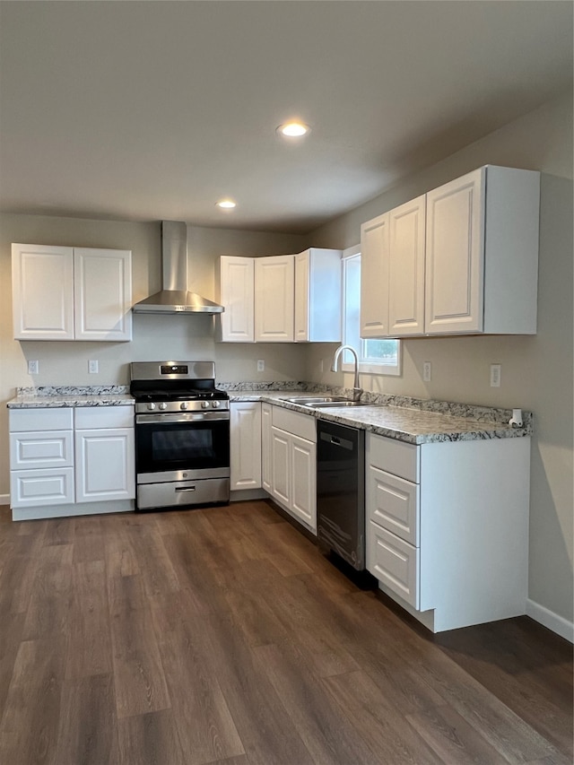 kitchen featuring wall chimney range hood, white cabinetry, stainless steel range oven, and black dishwasher