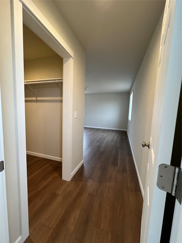 hallway featuring dark hardwood / wood-style floors