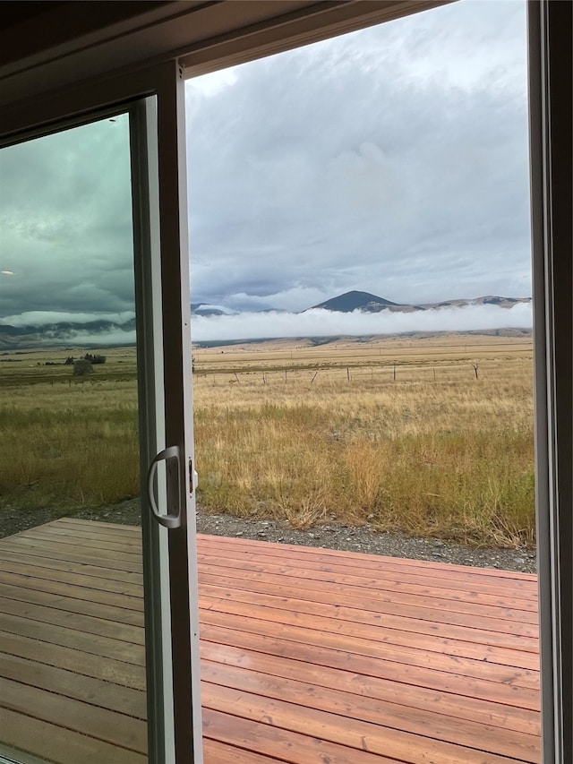 entryway with wood-type flooring and a rural view