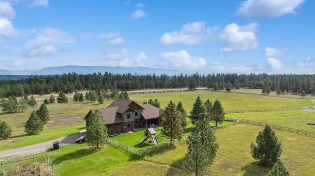 drone / aerial view with a mountain view and a rural view