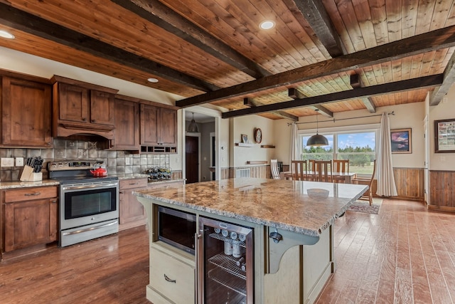 kitchen featuring wine cooler, a center island, wooden ceiling, stainless steel appliances, and beam ceiling