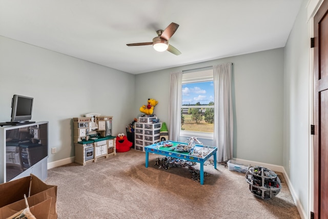 recreation room featuring ceiling fan and carpet