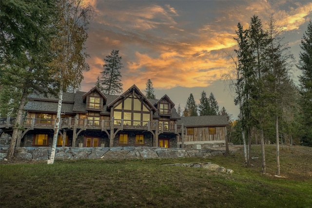 2870 US Highway 93 W, Whitefish, MT 59937 - back house at dusk featuring a yard