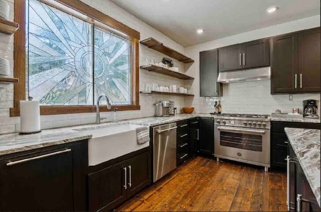 2870 US Highway 93 W, Whitefish, MT 59937 - kitchen featuring sink, decorative backsplash, stainless steel appliances, dark hardwood / wood-style flooring, and light stone countertops