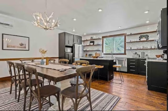 2870 US Highway 93 W, Whitefish, MT 59937 - dining area with wood finished floors, a chandelier, and recessed lighting