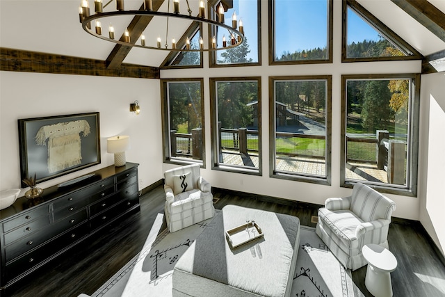 2870 US Highway 93 W, Whitefish, MT 59937 - living room featuring a wealth of natural light, beam ceiling, dark wood-type flooring, and a notable chandelier