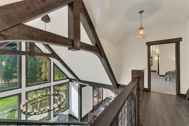 2870 US Highway 93 W, Whitefish, MT 59937 - corridor featuring wood finished floors, an upstairs landing, a chandelier, and high vaulted ceiling