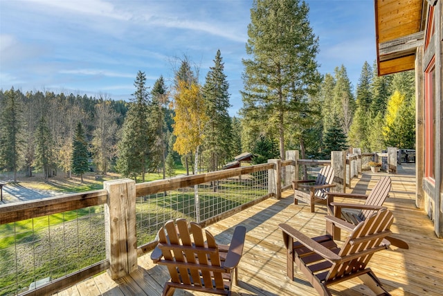 2870 US Highway 93 W, Whitefish, MT 59937 - wooden deck featuring a view of trees