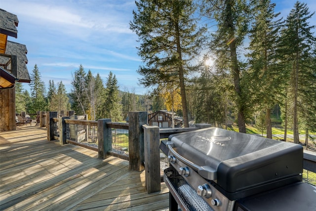 2870 US Highway 93 W, Whitefish, MT 59937 - wooden deck featuring a grill and a storage unit