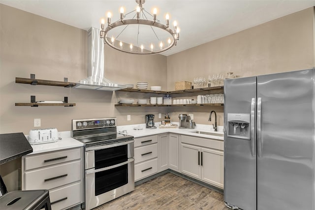 2870 US Highway 93 W, Whitefish, MT 59937 - kitchen featuring stainless steel appliances, open shelves, a chandelier, light wood finished floors, and light countertops