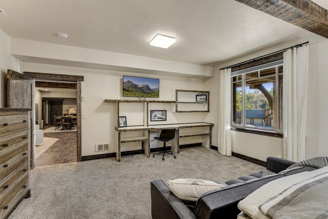 2870 US Highway 93 W, Whitefish, MT 59937 - carpeted bedroom with baseboards and a desk
