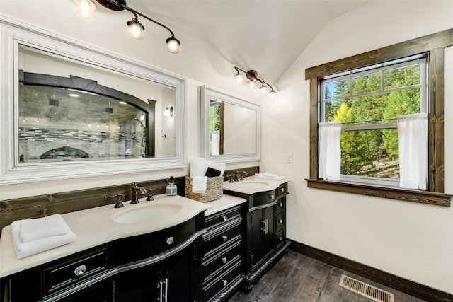 2870 US Highway 93 W, Whitefish, MT 59937 - bathroom with walk in shower, wood-type flooring, lofted ceiling, and vanity