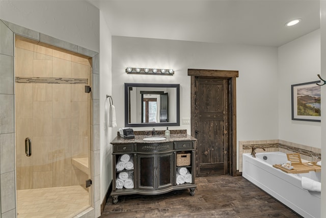2870 US Highway 93 W, Whitefish, MT 59937 - bathroom featuring wood-type flooring, vanity, and plus walk in shower