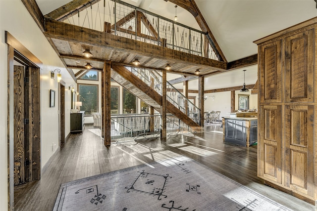 2870 US Highway 93 W, Whitefish, MT 59937 - entryway featuring high vaulted ceiling, beam ceiling, and dark hardwood / wood-style flooring
