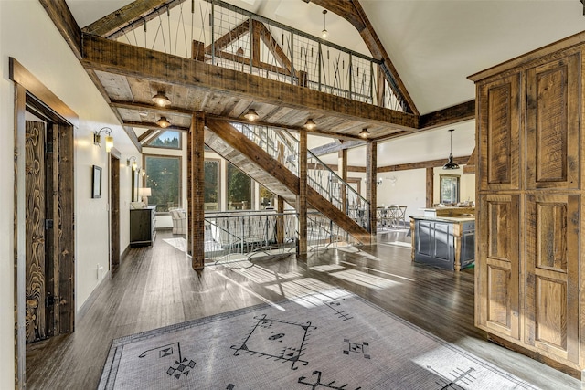 2870 US Highway 93 W, Whitefish, MT 59937 - hall with high vaulted ceiling, wood finished floors, stairway, and beam ceiling
