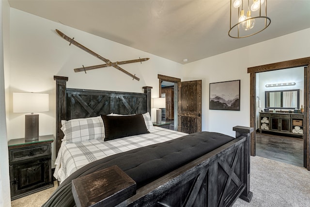 2870 US Highway 93 W, Whitefish, MT 59937 - bedroom with lofted ceiling, an inviting chandelier, and light colored carpet