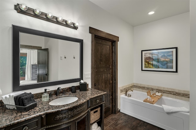 2870 US Highway 93 W, Whitefish, MT 59937 - bathroom featuring vanity, hardwood / wood-style flooring, and a tub