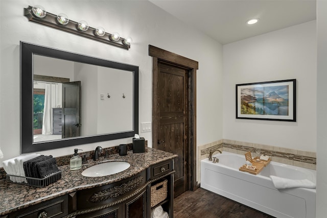 2870 US Highway 93 W, Whitefish, MT 59937 - full bathroom with vanity, wood finished floors, and a bath