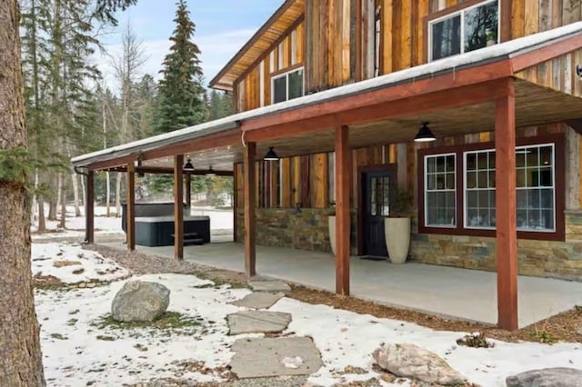 2870 US Highway 93 W, Whitefish, MT 59937 - exterior space featuring a hot tub, ceiling fan, and a patio area