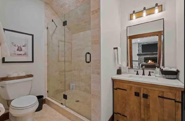 2870 US Highway 93 W, Whitefish, MT 59937 - full bath featuring a stone fireplace, a stall shower, and vanity