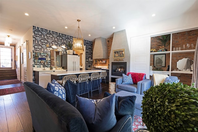 living room with a fireplace and dark hardwood / wood-style flooring