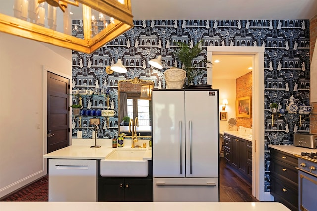 kitchen with dark hardwood / wood-style floors, ceiling fan, sink, and white refrigerator