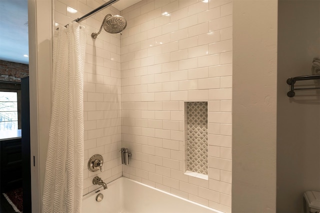 bathroom featuring shower / bathtub combination with curtain and toilet