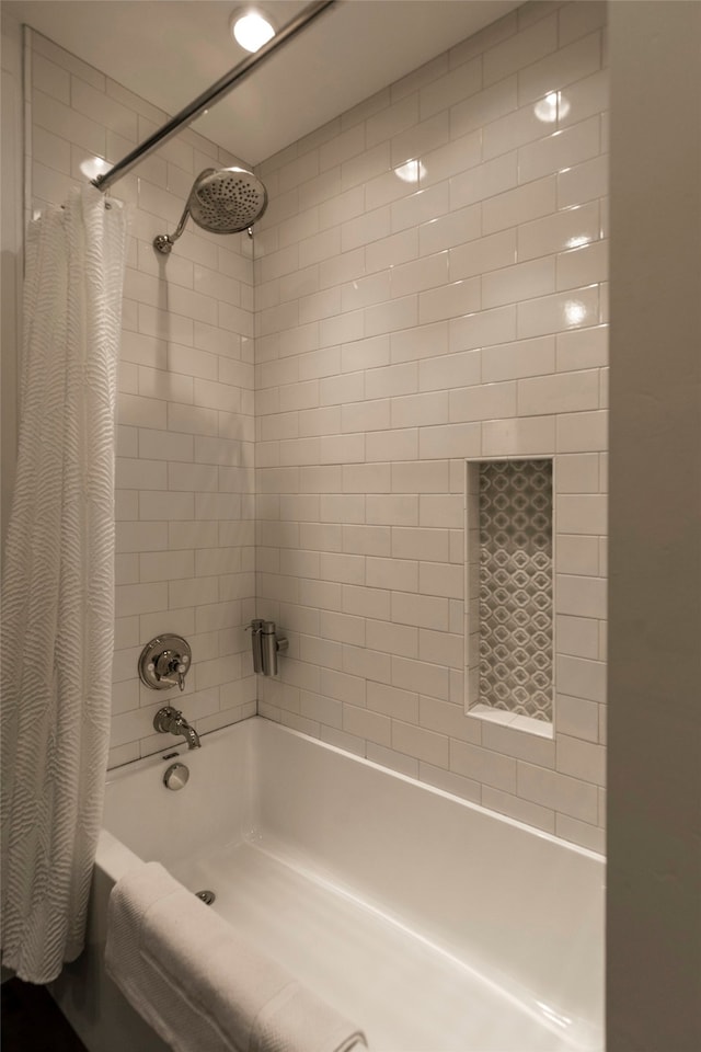 bathroom with shower / bath combination with curtain