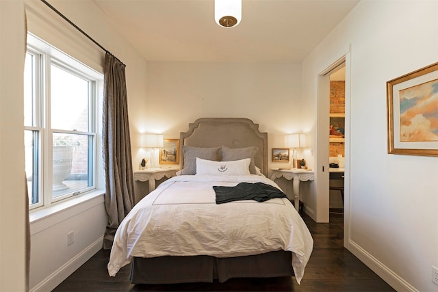 bedroom featuring dark hardwood / wood-style flooring