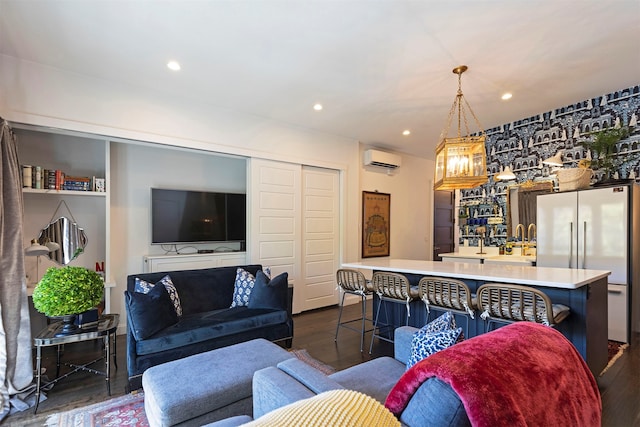 living room featuring wet bar, dark hardwood / wood-style floors, and a wall mounted air conditioner