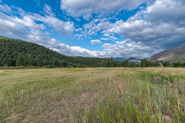 mountain view featuring a rural view