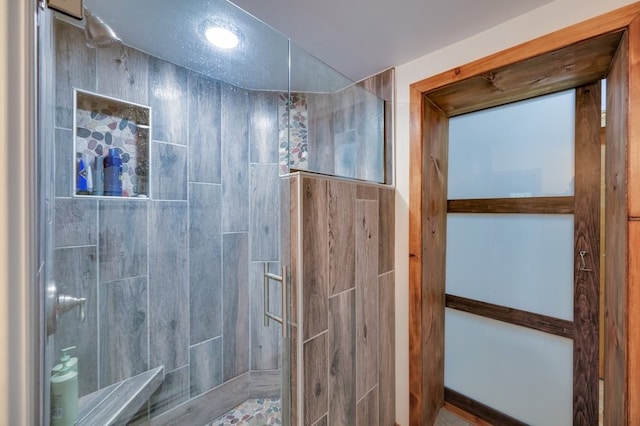 bathroom featuring a tile shower