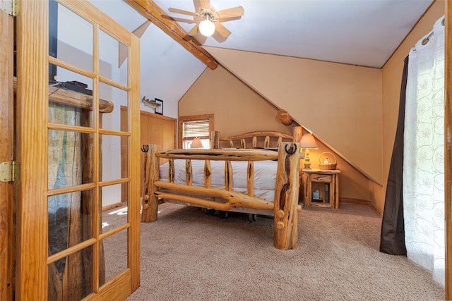 carpeted bedroom with lofted ceiling with beams and ceiling fan