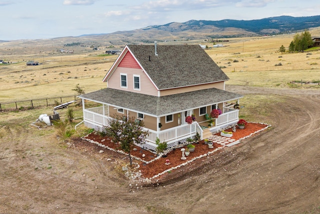 aerial view with a mountain view and a rural view