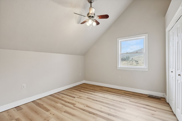 bonus room featuring lofted ceiling, light hardwood / wood-style floors, and ceiling fan