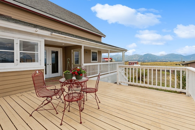 wooden deck with a mountain view