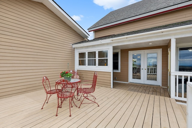 wooden deck featuring french doors