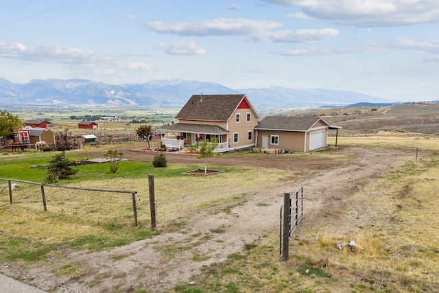 view of mountain feature with a rural view