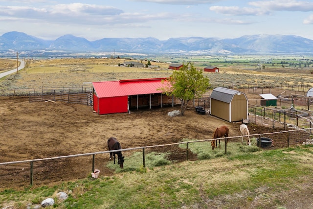 drone / aerial view featuring a mountain view and a rural view