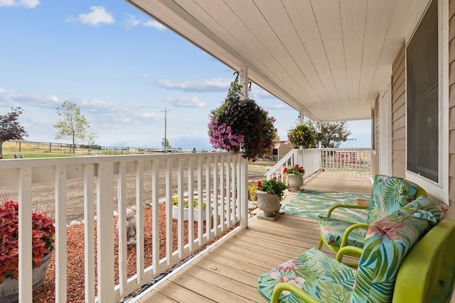 wooden terrace with a porch