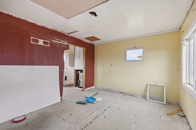 unfurnished room featuring plenty of natural light