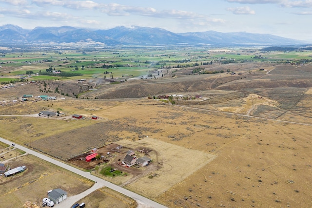 bird's eye view featuring a mountain view and a rural view