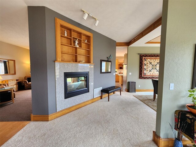 interior space featuring a fireplace and built in shelves