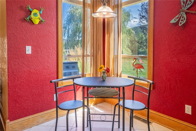 dining area with light tile patterned floors