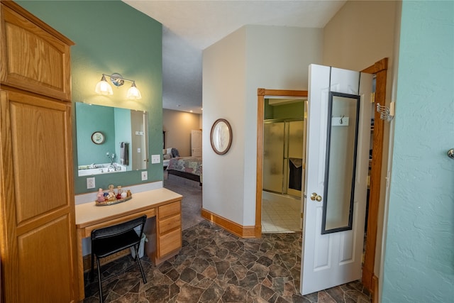 bathroom featuring a shower with shower door