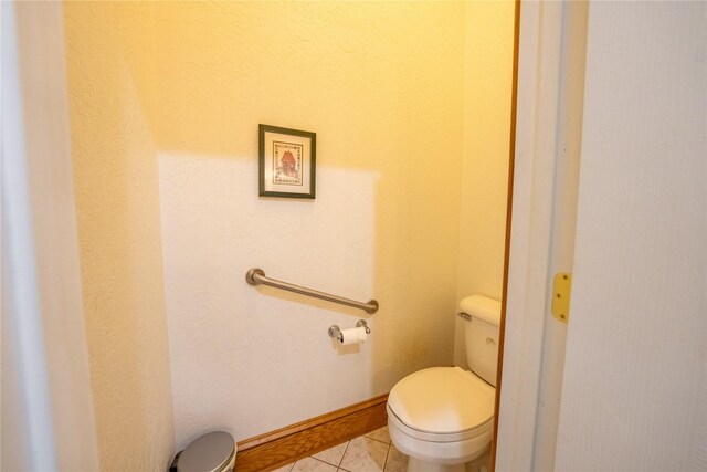 clothes washing area featuring cabinets, light tile patterned flooring, washer and clothes dryer, and sink