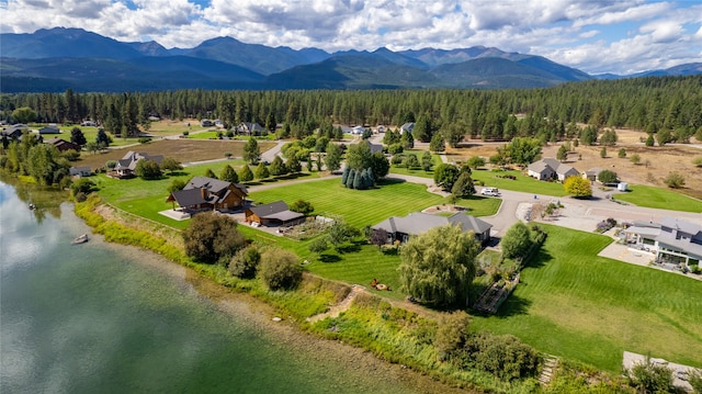 aerial view featuring a water and mountain view