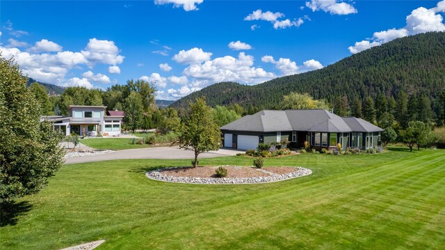 back of property with a lawn and a patio