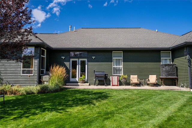 view of property exterior featuring central AC unit and a lawn