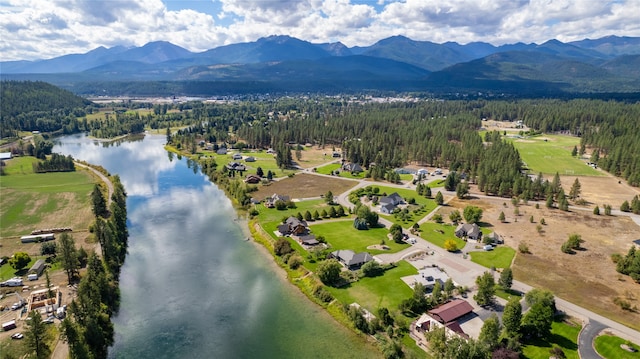 aerial view featuring a water and mountain view